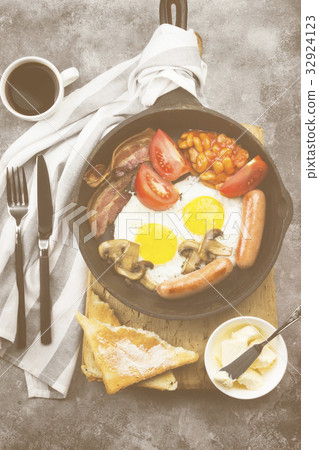Traditional English breakfast - bacon, sausages Traditional English breakfast - bacon, sausages 32924123
