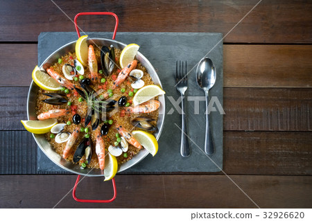 Paella with seafood vegetables and saffron Paella with seafood vegetables and saffron 32926620
