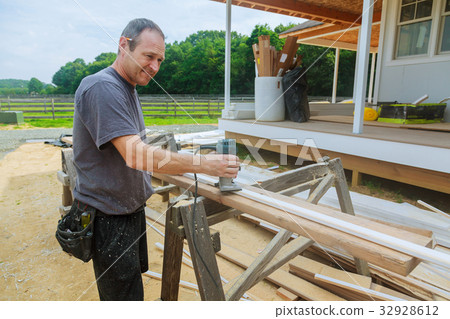 workers using electric routering cut down stripes 32928612