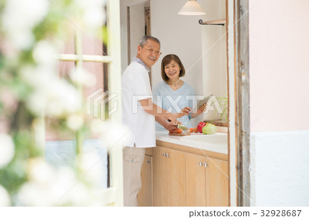 Senior couple kitchen cooking lifestyle Senior couple kitchen cooking lifestyle 32928687