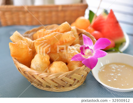 Deep-fried doughstick breakfast. 32930912