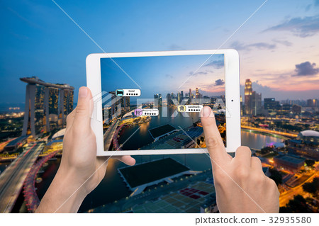 Hand holding smart phone use AR application Hand holding smart phone use AR application 32935580