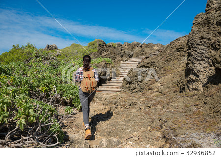 portrait of hiker walking enter at the rocks 32936852