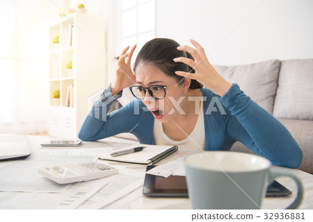 shocked woman checking expensive bills shocked woman checking expensive bills 32936881