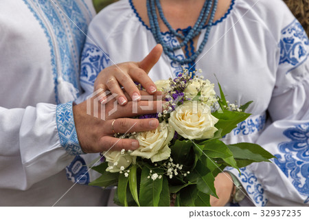 Wedding bouquet in bride hands in ukrainian style 32937235