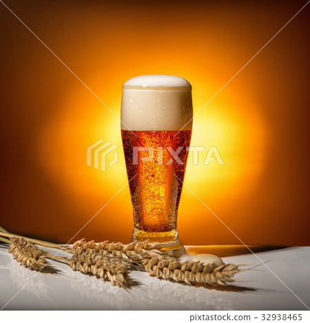 dark glass beer with ears of wheat on light dark glass beer with ears of wheat on light 32938465