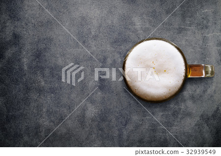 Glass of beer on Loft Cement Table, Top view Glass of beer on Loft Cement Table, Top view 32939549