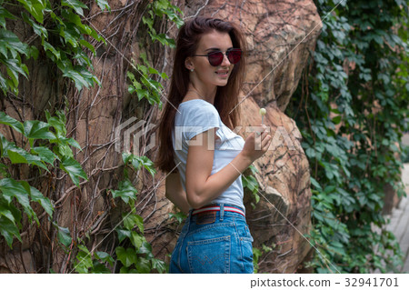attractive young brunette in mirrored glasses attractive young brunette in mirrored glasses 32941701