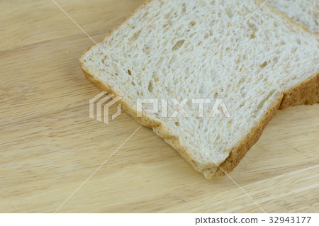Bread whole wheat on wood background 32943177