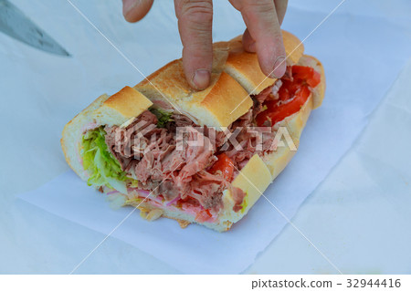 Freshly made sandwich with lettuce tomato and meat Freshly made sandwich with lettuce tomato and meat 32944416