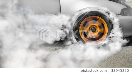 Drag racing car burns off its tires for the race Drag racing car burns off its tires for the race 32945230