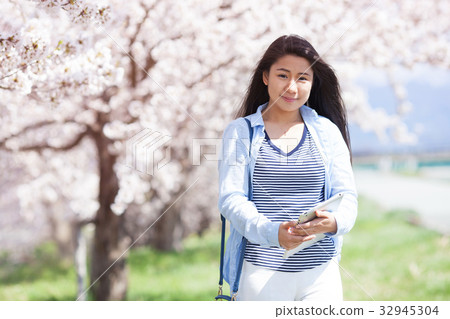 Cherry tree and young woman 32945304