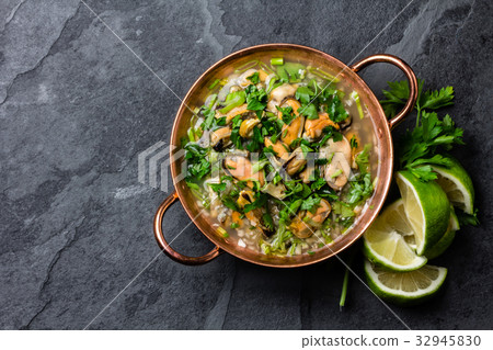 Peruvian food. Mussels ceviche. Cold soup with 32945830