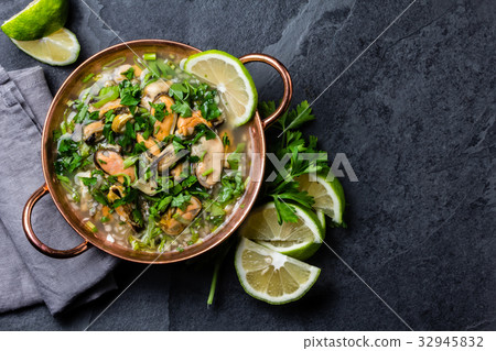 Peruvian food. Mussels ceviche. Cold soup with 32945832