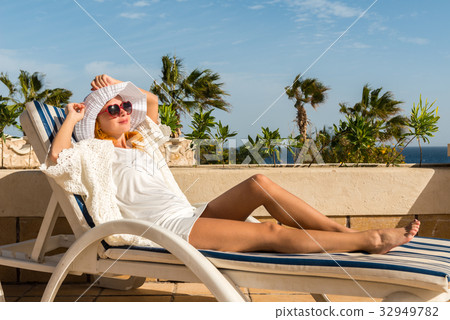 Young woman enjoying sun Young woman enjoying sun 32949782