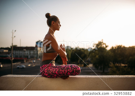 Beautiful young woman relax in yoga pose Beautiful young woman relax in yoga pose 32953882
