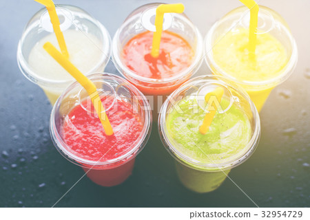 Colored Smothies Take Away in Plastic 32954729