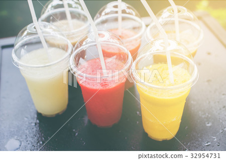 Colored Smothies Take Away in Plastic 32954731