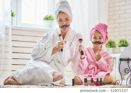 woman and girl with mustache on sticks woman and girl with mustache on sticks 32955337