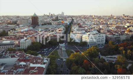 Fly over the evening Madrid with a view of the 32956578