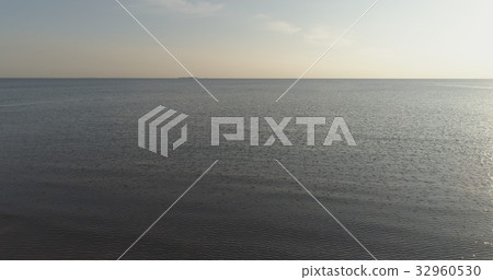 Aerial shot over baltic sea in bright sunset time 32960530