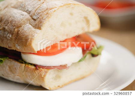 closeup shot of ciabatta sandwich with speck 32960857