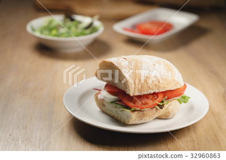 ciabatta sandwich with speck, mozzarella and 32960863