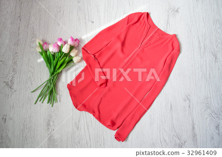 Coral blouse, bouquet tulips. Fashionable concept 32961409