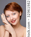 beauty portrait of young woman on gray 32961982