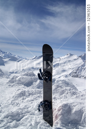 Snowboard against the hight mountains Snowboard against the hight mountains 32963015