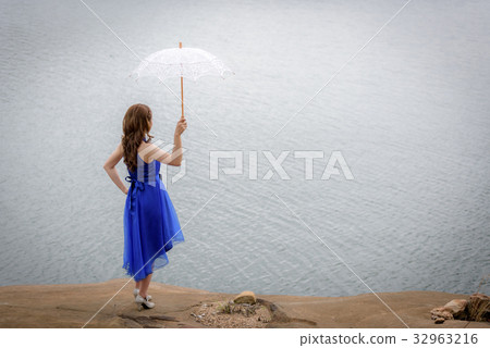 blue evening dress hold white umbrella blue evening dress hold white umbrella 32963216