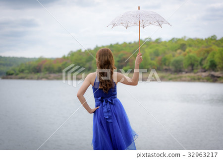 blue evening dress hold white umbrella blue evening dress hold white umbrella 32963217