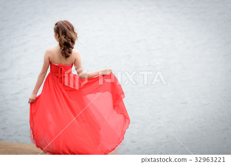red evening dress enjoying on the mountain. red evening dress enjoying on the mountain. 32963221