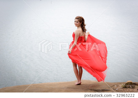 red evening dress enjoying on the mountain. red evening dress enjoying on the mountain. 32963222