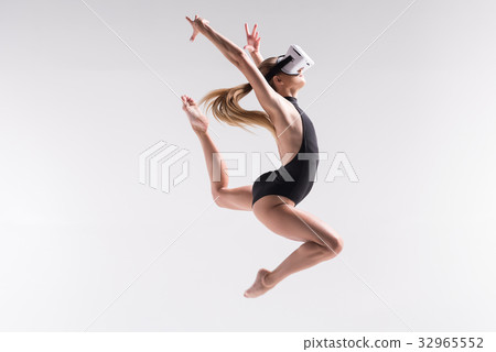 Serious youthful fit woman doing exercise with 32965552