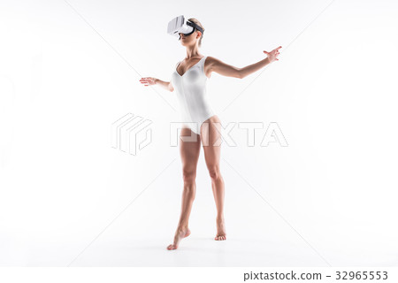 Somber young lady exercising with help of vr 32965553