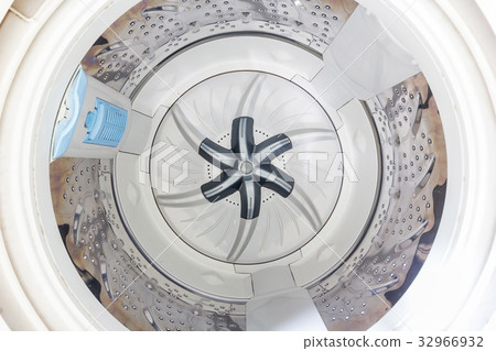 Internal view of an empty washing machine drum 32966932
