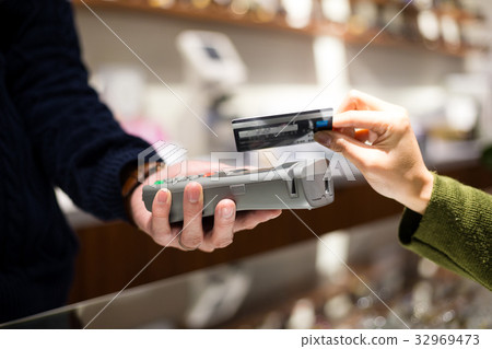 Customer pay by NFC at shop Customer pay by NFC at shop 32969473