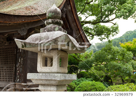 Stone lantern in the garden 32969979