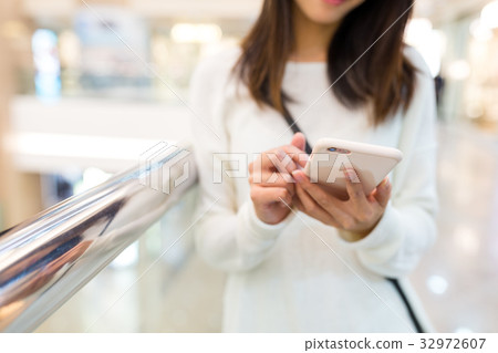 Woman use of mobile phone Woman use of mobile phone 32972607