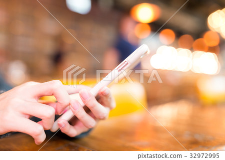 Woman using cellphone Woman using cellphone 32972995