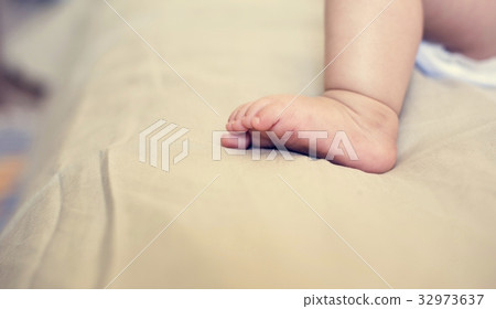 A little baby is resting at home. A little baby is resting at home. 32973637
