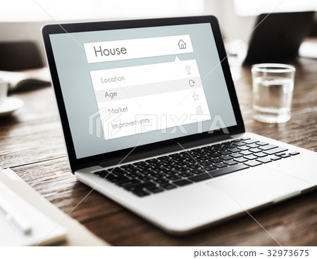 Real estate residential investment graphic on laptop Real estate residential investment graphic on laptop 32973675