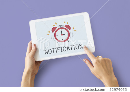 Digital tablet alarm notification for important appointment Digital tablet alarm notification for important appointment 32974053
