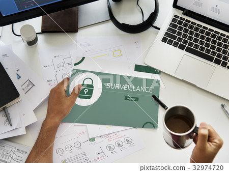 Hand holding banner with illustration of computer security system Hand holding banner with illustration of computer security system 32974720