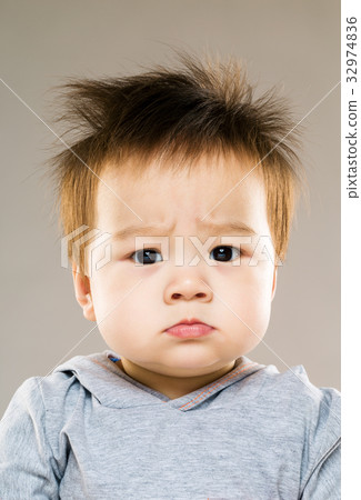 Frowning eye baby 32974836