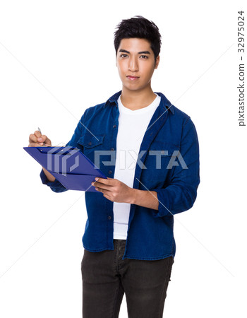 Chinese mixed iranian man write on the file board 32975024