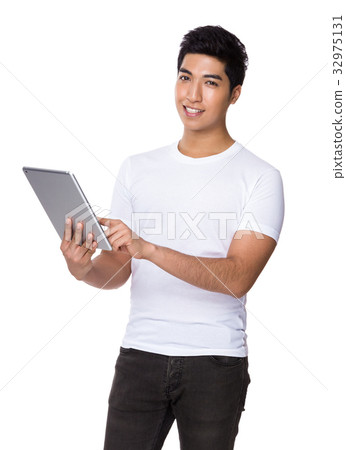 Asian man use of tablet Asian man use of tablet 32975131
