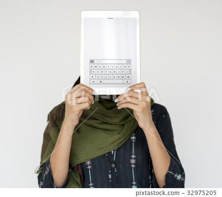 Woman holding network graphic overlay digital device covering face Woman holding network graphic overlay digital device covering face 32975205