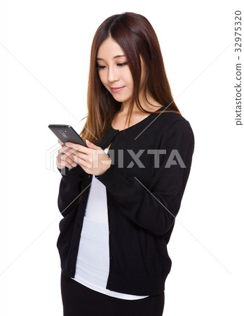 Asian woman read on the mobile phone Asian woman read on the mobile phone 32975320